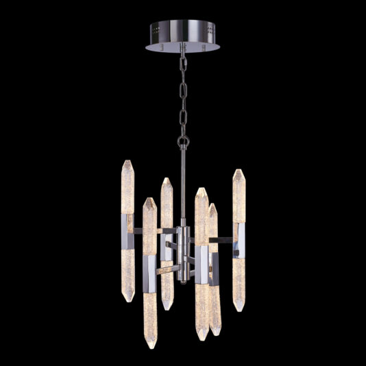 The Exclusive Chrome Vertical Crystal Chandelier features multiple crystal-like LED elements arranged vertically in a circular pattern around a central metal rod. It is suspended from the ceiling by a chain and a round, chrome mounting plate. The lights have a textured appearance, emitting a soft, warm glow.