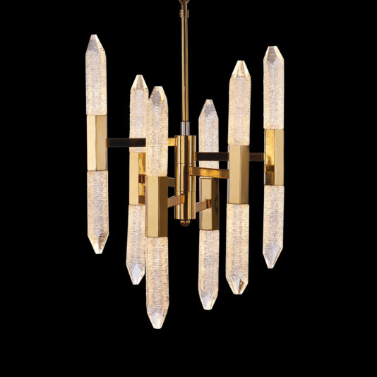 Exclusive Gold Vertical Crystal Chandelier The Exclusive Gold Vertical Crystal Chandelier, featuring a gold frame and elongated vertical crystal elements, radiates elegance. The textured glass beautifully diffuses light, creating a sophisticated ambiance as it hangs against a black background.