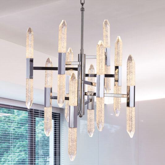The Exclusive Chandelier With Vertical Crystals boasts a modern design, featuring elongated textured glass pendants and stunning vertical crystals arranged in an intricate geometric pattern. Metal accents and a central rod support the chandelier, making it the perfect addition to a room with white walls and large windows with partially open blinds.