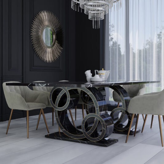 A modern dining room showcases the Exclusive Rectangular Marble Dining Table with a unique, looped black and gold base. Around the table are six light gray, cushioned chairs with wooden legs. Behind, a window with sheer curtains allows natural light to flood in, and a decorative sunburst mirror adorns the dark wall.