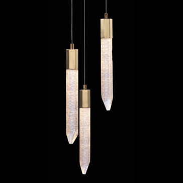 Exclusive Triple Gold Pendant Light Introducing the Exclusive Triple Gold Pendant Light set, which features textured, elongated glass diffusers with pointed ends. These elegant lights are suspended from black cords and encased in sleek bronze mountings, all set against a striking black background.