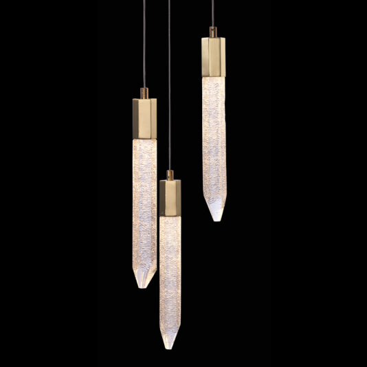 Introducing the Exclusive Triple Gold Pendant Light set, which features textured, elongated glass diffusers with pointed ends. These elegant lights are suspended from black cords and encased in sleek bronze mountings, all set against a striking black background.