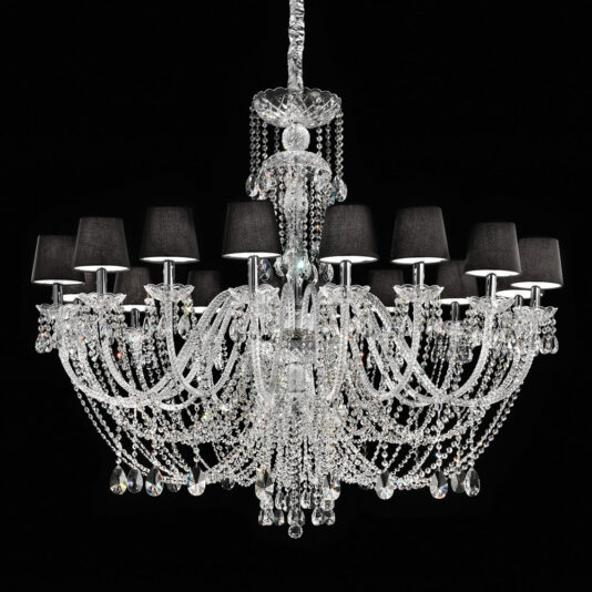 A sophisticated Large Crystal Chandelier With Shades, boasting multiple intricate arms adorned with hanging crystal ornaments and black lampshades, set against a dark background. This grand chandelier showcases numerous strands of delicate crystal beads that reflect light beautifully.