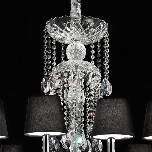Large Crystal Chandelier With Shades A close-up view of the Large Crystal Chandelier With Shades, showcasing cascading beads and intricate glasswork, adorned with several black fabric lampshades. Set against a dark background, the chandelier's sparkling and reflective crystal elements are beautifully highlighted.