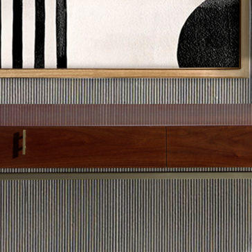 Luxury Walnut Veneer Console Table A framed abstract artwork showcasing black vertical lines and shapes on a white background graces the wall. Just below it, the Luxury Walnut Veneer Console Table with its minimalist design and metallic handle beautifully complements the textured wall.