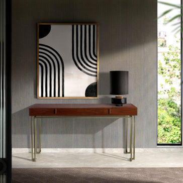Luxury Walnut Veneer Console Table A modern interior featuring the Luxury Walnut Veneer Console Table adorned with a black lamp and small decor items. Above the table hangs a framed abstract art piece showcasing bold black and white geometric patterns. The background reveals textured walls and a view of greenery.