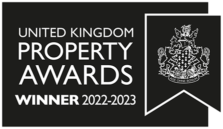 A black and white banner featuring the United Kingdom Property Awards logo with a coat of arms. The banner includes text: "United Kingdom Property Awards WINNER 2022-2023.