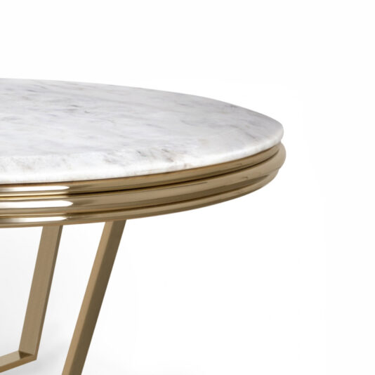 A close-up view of the Contemporary Round Marble Coffee Table's edge showcases a white marble top paired with a polished gold metal frame and minimalist supports. This table features a contemporary design characterized by sleek, clean lines.