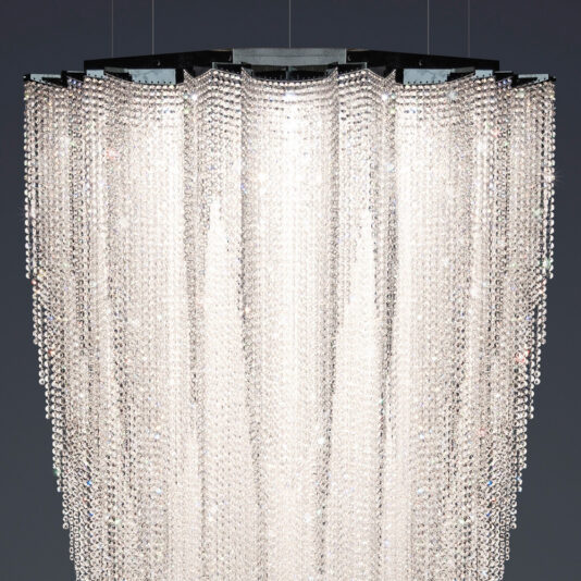 Luxury Suspended Crystal Pendant Chandelier The Luxury Suspended Crystal Pendant Chandelier, with its multi-tiered cascading crystal strands, beautifully reflects light to create a dazzling and elegant look against dark backgrounds.