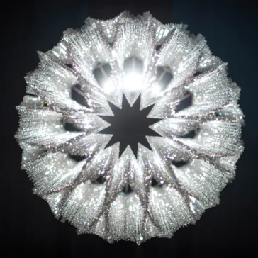 A radiant, detailed spherical sculpture with starburst-like spikes and sparkling details resembles the Luxury Suspended Crystal Pendant Chandelier against a dark backdrop.