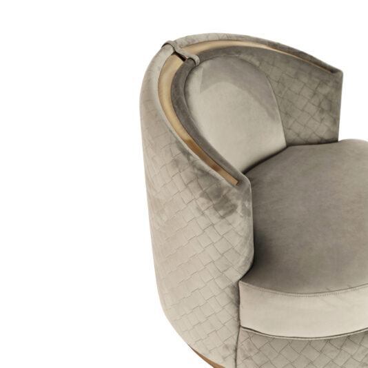 Modern Quilted Velvet Swivel Tub Chair The Modern Quilted Velvet Swivel Tub Chair showcases a sophisticated curved design with light grey upholstery. This chair features a quilted backrest and a wooden accent along the top edge, offering an elegant touch.
