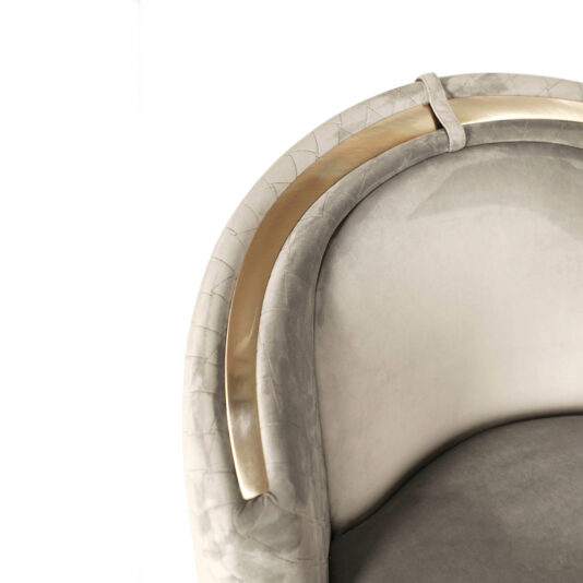 Modern Quilted Velvet Swivel Tub Chair A close-up view of the upper part of the luxurious