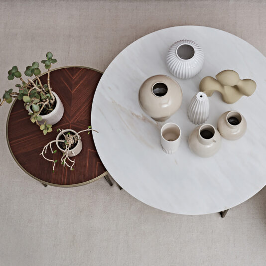 A modern set of round coffee tables, named the 