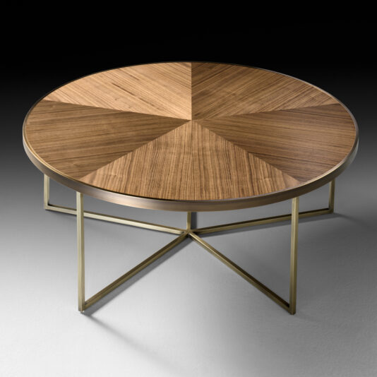 The Round Walnut Veneer Coffee Table Set features a sleek, round design with a geometric wooden top that showcases various wood grain patterns. It is supported by a gold metal frame with intersecting legs forming a star-shaped design, set against a neutral, gradient background.