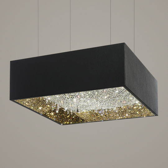 The Luxury Square Crystal Chandelier is elegantly suspended from the ceiling with thin wires. The bottom surface sparkles with an array of small, reflective crystals, creating a luminous and sophisticated look against the plain background.