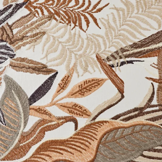 Luxury Suspension Light With Embroidered Shade Close-up of the Luxury Suspension Light With Embroidered Shade, showcasing intricate embroidery that illustrates an abstract nature scene with leaves, branches, and ferns in brown, tan, and cream threads on a light background.
