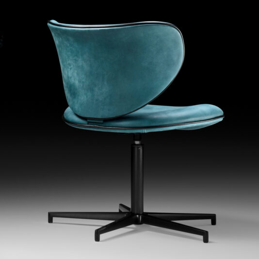 Retro Inspired Swivel Office Chair The Retro Inspired Swivel Office Chair boasts a sleek, curved backrest and seat upholstered in luxurious blue-green velvet. Its sturdy black metal base features five legs for seamless swivel functionality. Complementing its elegant design is a backdrop that transitions from black at the top to gray at the bottom, lending a modern aesthetic.