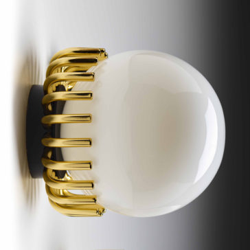 The Small Contemporary Sphere Wall Light showcases a white spherical bulb with a modern, elegant design, partially encased in a gold metallic frame. Evenly spaced bars wrap around the bottom half of the light, set against a backdrop that shifts from bright on the left to dark on the right, producing a striking gradient effect.