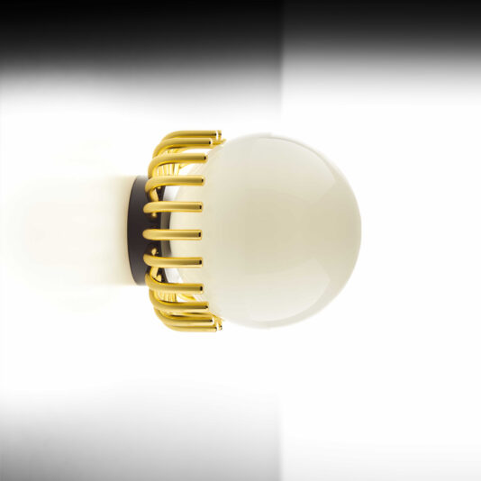 The Small Contemporary Sphere Wall Light features a white spherical bulb encased in a series of vertical, evenly spaced gold metallic rods, all mounted on a circular black base that's affixed to a white and black gradient wall.
