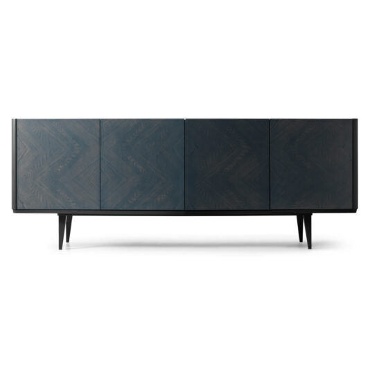 The Smoked Black Ash Sideboard is a sleek, modern piece with a chevron pattern, featuring four doors and slim, tapered legs. Its minimalist design and polished finish perfectly blend contemporary style with classic elements.