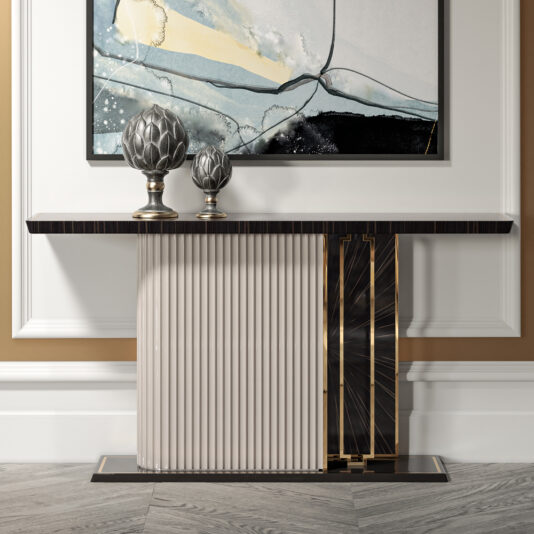 The Art Deco Style Veneer Console Table, blending wood, glass, and metal materials, is accompanied by two decorative candle holders. It stands against a white-paneled wall beneath a colorful abstract painting that combines soft hues and geometric patterns.