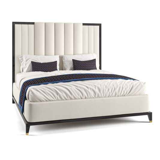 The High End Art Deco Style Bed showcases an upholstered white headboard with vertical tufted panels. It comes complete with a white mattress, white bedding, and two white pillows, each topped with a decorative black and blue geometric-patterned pillow. Also included is a matching black and blue bed runner.