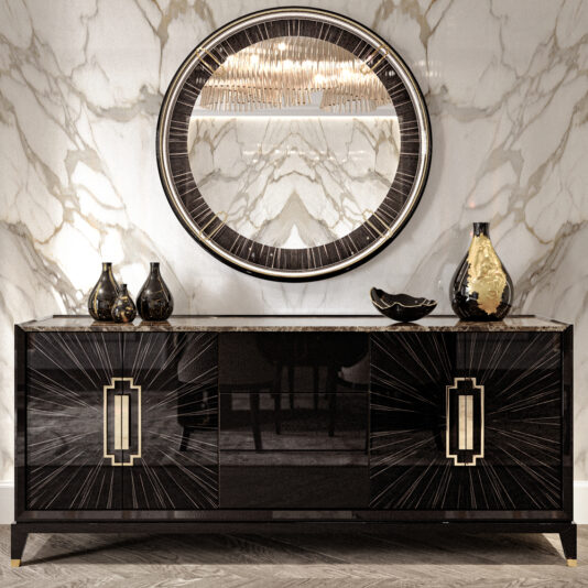 An elegant, modern interior featuring the High End Veneer And Marble Sideboard with gold accents and sunburst patterns. Above it hangs a round mirror with matching design elements. Decorative black and gold vases adorn the sideboard, set against a marbled wall backdrop.