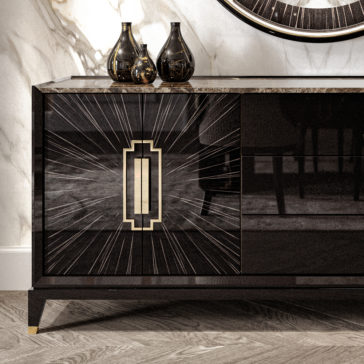 The High End Veneer And Marble Sideboard with a black veneer finish and gold geometric sunburst designs on its doors stands against a marble wall. Three black vases of varying shapes and sizes adorn the top, while the herringbone wood floor adds an elegant touch.