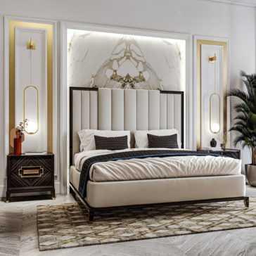 Stylish bedroom featuring a large bed with a tufted headboard and dark wooden frame. Two High End Veneer Bedside Cabinets, each topped with a modern lamp, flank the bed. The marble backdrop boasts gold accents, while a patterned rug complements the light wood floor. A leafy plant adds a touch of nature in the corner.