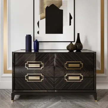 High End Veneer Chest Of Drawers A contemporary room showcases the High End Veneer Chest Of Drawers, crafted with dark wood and equipped with four drawers, each featuring gold geometric handles. Atop the dresser are two blue vases and two patterned black vases. Above it hangs an abstract black-and-white painting with gold accents.