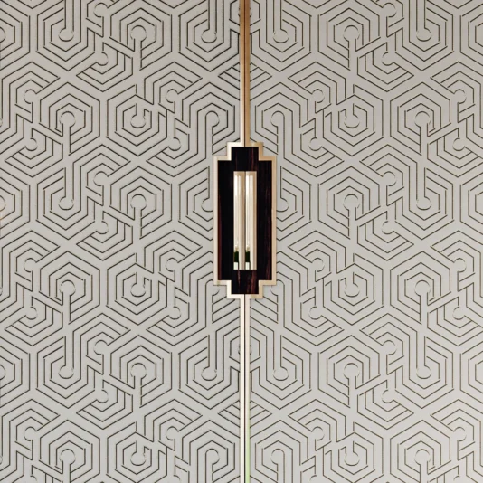 Large High End Integrated Wardrobe A geometric wallpaper featuring a hexagonal maze pattern in dark lines against a light background sets the stage, highlighted by a glowing sconce, perfectly complementing the sleek, layered design of the Large High End Integrated Wardrobe.