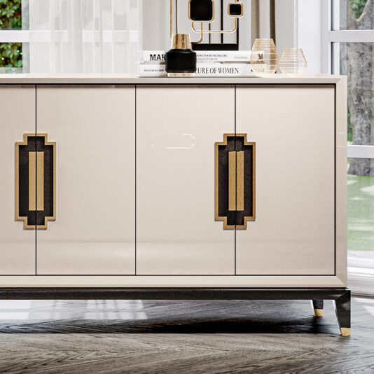 Large High End Lacquered Sideboard A Large High End Lacquered Sideboard with geometric handles graces the living room. On top of the sideboard are decorative items including a vase, a candle holder, and two books. Sunlight streams in through a large window, illuminating the scene and offering a view of greenery outside.