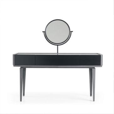 Modern Dressing Table With Mirror The Modern Dressing Table With Mirror is a sleek black piece featuring a rectangular tabletop and three drawers. It includes a round, adjustable mirror mounted on a simple stand. The vanity rests on four slender, tapered legs and showcases a minimalist design against a white background.