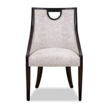 The Modern Walnut Luxury Dining Chair is a contemporary piece featuring a dark walnut frame, light grey cushioned backrest and seat, and a cutout handle near the top of the backrest. Its sleek design includes slightly curved legs for added elegance.