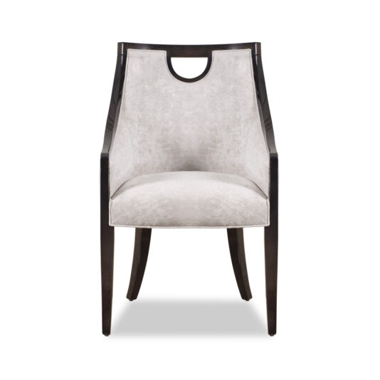 Modern Walnut Luxury Dining Chair The Modern Walnut Luxury Dining Chair showcases a sleek walnut frame with elegantly curved arms and legs. It features a smooth, light gray upholstered seat and backrest, enhanced by a stylish cut-out handle at the top of the backrest.