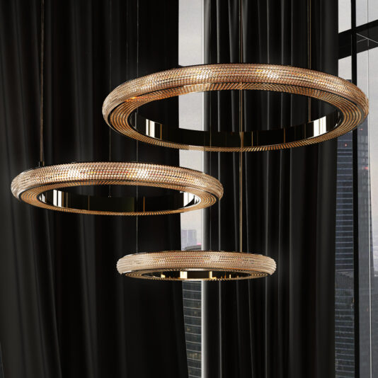 Contemporary Hoop Crystal Chandelier Three Contemporary Hoop Crystal Chandeliers, featuring an intricate geometric design and a luxurious golden color, hang at varied heights against a backdrop of black curtains and a window revealing the city skyline. These elegant fixtures infuse the space with luxury and sophistication.