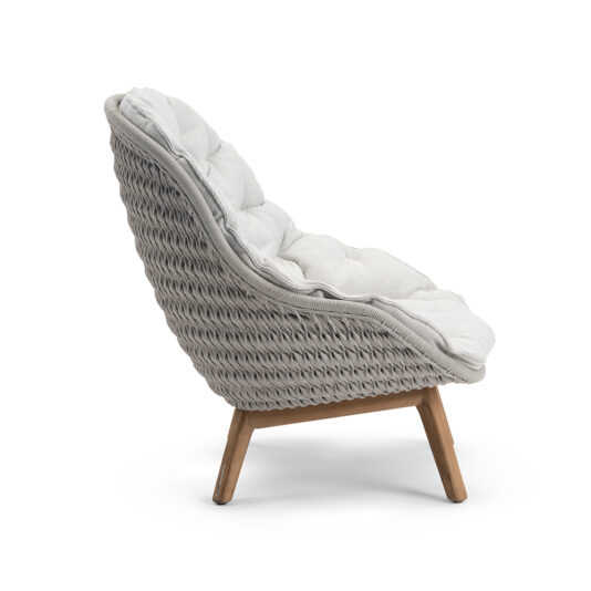 Contemporary Outdoor Woven Armchair Side view of the Contemporary Outdoor Woven Armchair, showcasing its modern woven design. The chair features light-colored, plush cushioning and wooden legs angled slightly backward for a relaxed seating posture, making it perfect for outdoor settings.