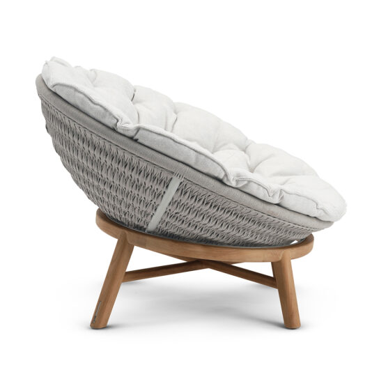 Contemporary Outdoor Woven Daybed The Contemporary Outdoor Woven Daybed features a modern, round design with gray wicker and a thick, plush white cushion. It sits elevated on a sturdy wooden base with four legs, making it ideal for both indoor and outdoor relaxation. This chic daybed combines stylish comfort with versatility, perfect for your leisure.