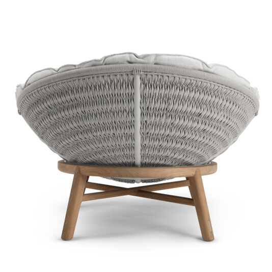 Contemporary Outdoor Woven Daybed The Contemporary Outdoor Woven Daybed, as viewed from the back, showcases a stylish and contemporary design with a woven rattan pattern. It features a grey cushioned seat and wooden legs arranged in a tripod formation, highlighting intricate detailing that provides both support and aesthetic appeal.