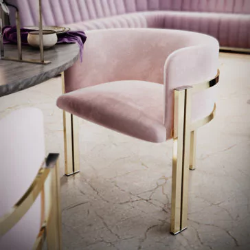 Round Modern Ribbed Veneer Dining Set A stylish Round Modern Ribbed Veneer Dining Set is showcased with a plush pink chair featuring gold metal legs next to the modern, round table. The table's stone-like surface holds a small bowl and a folded purple cloth. In the background, a curved pink cushioned bench hugs the wall. The floor boasts a light-colored, cracked veneer finish.