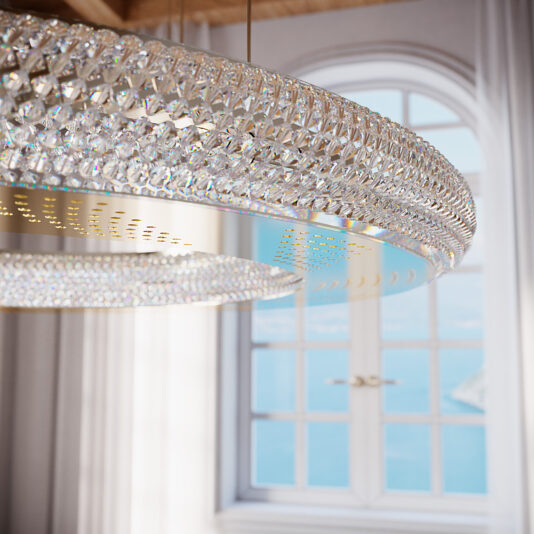 Modern Crystal Hoop Chandelier Close-up shot of the Modern Crystal Hoop Chandelier with an elegant circular shape. In the background, a large, arched window with white curtains offers a scenic view of a bright, sunny day outside. The focus is on the chandelier.
