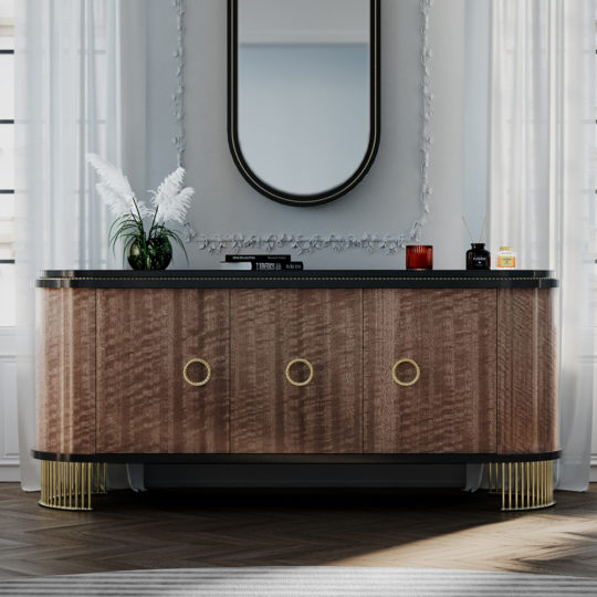 A sleek, sophisticated console table boasts a delicate, curved design with a wood finish and gold accents. Mounted above is an arched mirror framed in black. The table is decorated with elegant white feather decor, a small red candle, and a charming jar. Nearby stands the Oval Veneer 3 Door Buffet. The room features light-colored walls bathed in natural light streaming through the windows.