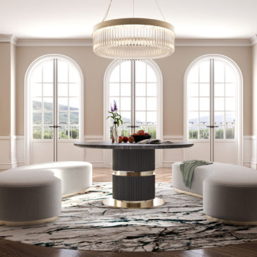 Round Modern Ribbed Veneer Dining Table A contemporary dining room showcases the Round Modern Ribbed Veneer Dining Table adorned with a centerpiece, encircled by circular white ottomans on a patterned rug. Expansive arched windows provide abundant natural light, and an elegant chandelier hangs above the table. The space is decorated in neutral tones.