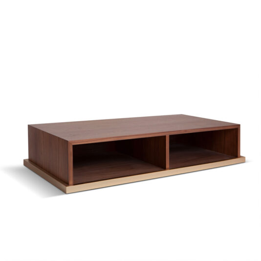 Walnut Veneer Box Style Storage Coffee Table The Walnut Veneer Box Style Storage Coffee Table is a modern, low-profile piece crafted from dark walnut veneer with a rectangular design. It includes box-style storage compartments and rests on a lighter-colored base. The table's surface is smooth and showcases clean lines for a minimalist look.