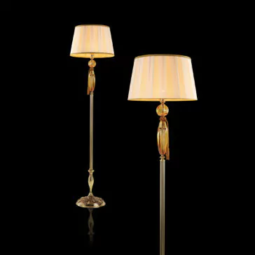 Luxury Amber Glass Floor Lamp Two elegant floor lamps with beige shades and gold accents stand against a black background. The lamps feature a striped, slightly tapered shade and a slender, ornate pole with decorative elements, including an intricate base and a golden midsection reminiscent of the Luxury Amber Glass Floor Lamp.