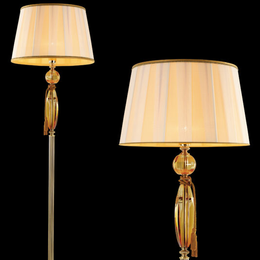 Luxury Amber Glass Floor Lamp The Luxury Amber Glass Floor Lamp features an elegant design with gold bases and beige lampshades. It boasts ornate amber glass orbs adorned with golden details and tassels, adding a touch of luxury. The lamp emits a soft yellow light, creating a warm ambiance against a plain black background.
