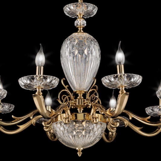 The Luxury Faceted Blown Glass Chandelier is a sophisticated and elegant lighting fixture featuring six candle-like lights. It boasts an ornate brass design with intricate crystal detailing, presenting a luxurious and classic aesthetic. The chandelier stands out prominently against the black background, enhancing its opulent appeal.