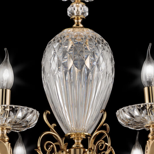 A close-up of the Luxury Faceted Blown Glass Chandelier, showcasing intricate crystal and gold details. The central faceted crystal piece is large and multifaceted, with four surrounding candle-like light bulbs, each adorned with its own crystal dish beneath a flame-shaped bulb. The background is black.