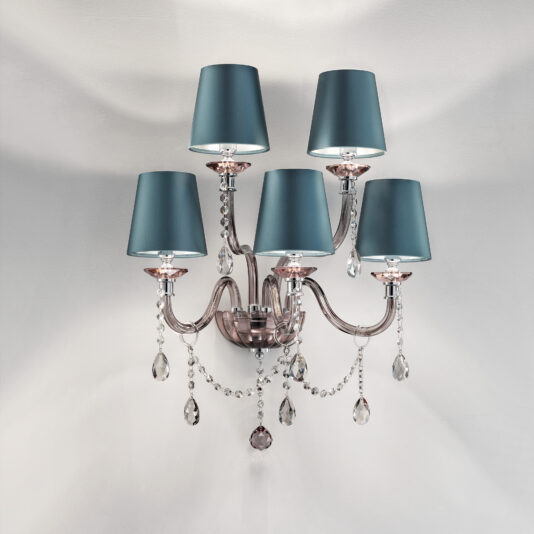 Modern Smoked Glass Wall Light With Shades The Modern Smoked Glass Wall Light With Shades showcases five teal lampshades on gracefully curved metallic arms. Clear crystal droplets dangle from the arms, reflecting light and adding a touch of sophistication to the fixture, all set against a light gray wall.