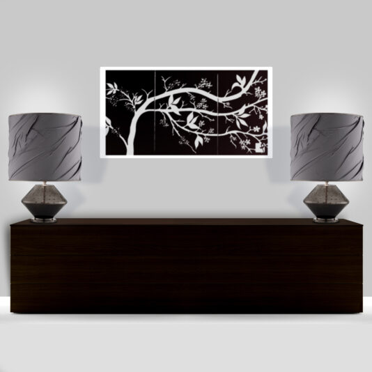 Modern Hand Blown Glass Table Lamp A modern, minimalist interior showcases a dark wooden console against a light gray wall. Two Modern Hand Blown Glass Table Lamps are symmetrically placed on the console. Above them hangs artwork depicting a white tree branch with leaves on a dark background.